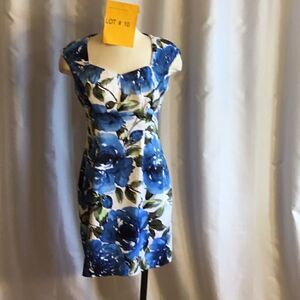Sleeveless dress with bold flower design in size 6